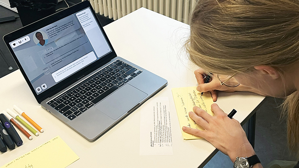 woman taking notes of the prototype