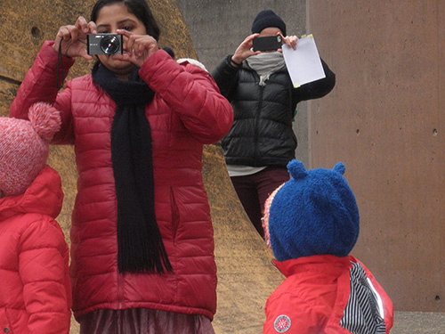 situation of two woman taking a photography outdoors